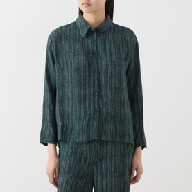 Model wearing Transit Stripe Pocket Shirt in petrol, featuring collared neckline, three-quarter sleeves and stripe pattern, styled with matching