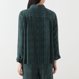Model wearing Transit Stripe Pocket Shirt in petrol, showing rear view with three-quarter sleeves, textured stripe finish, styled with matching