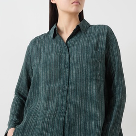 Model wearing Transit Stripe Pocket Shirt in petrol, featuring collared neckline, button fastening, chest pocket and vertical stripe pattern