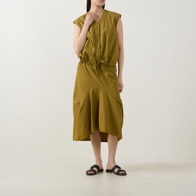 Model wearing Transit olive cotton shirt styled with matching midi skirt and brown flat sandals