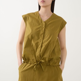 Model wearing Transit olive cotton shirt with V-neckline, button front, cap sleeves, and drawstring waist detail