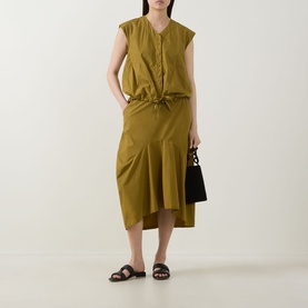 Model wearing Transit olive cotton midi skirt with asymmetric hem, styled with matching sleeveless top, black sandals and small black handbag.