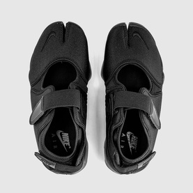 Nike Air Rift split-toe trainers in black with adjustable hook-and-loop strap, overhead flat-lay view