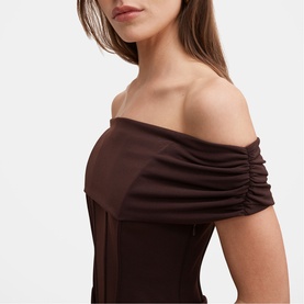Model wearing Forever New dark chocolate off-shoulder dress with ruched sleeve detail and structured bodice.