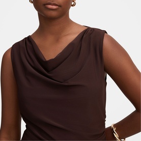 Model wearing Forever New Dark Chocolate sleeveless cowl-neck dress, styled with gold bracelet and earrings.