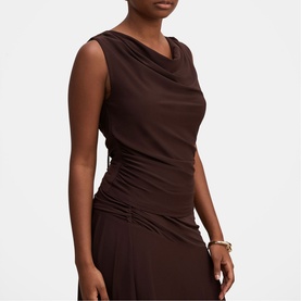 Model wearing Forever New Dark Chocolate sleeveless cowl-neck top with ruched side detail, styled with matching dark brown skirt and gold bracelet.