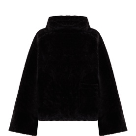 Annette Gortz cocoa shearling knitwear jacket with funnel neck, wide sleeves, and chest patch pocket, back view
