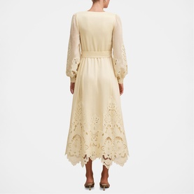 Model wearing Forever New Soft Yellow midi dress with sheer long sleeves, broderie anglaise hem, and scalloped edge detailing, rear view.