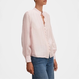 Model wearing Forever New blush pink button-front blouse with pintuck detail, blouson sleeves and mandarin collar, styled with blue jeans
