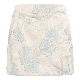 Cream mini skirt with blue floral jacquard embroidery, structured silhouette and above-knee length