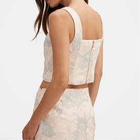 Model wearing cream floral jacquard crop top with square neckline and zip back, styled with matching midi skirt