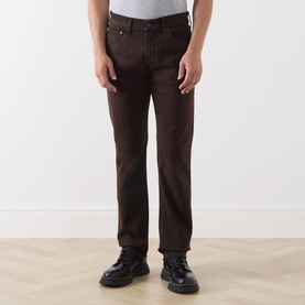 Model wearing Citizens of Humanity Straight Jeans in Tobacco, styled with black leather boots and a grey T-shirt.