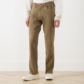 Model wearing Citizens of Humanity Dark Khaki straight jeans, styled with white trainers and a white shirt.
