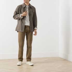 Model wearing Citizens of Humanity Dark Khaki straight jeans, styled with a taupe overshirt, grey top and white trainers.