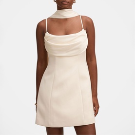 Model wearing Forever New Cannoli Cream mini dress with cowl neckline, spaghetti straps and attached neck scarf detail