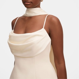 Model wearing Forever New Cannoli Cream satin cowl-neck midi dress with thin straps and mock-neck detail.