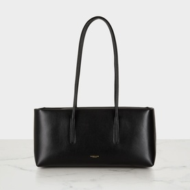 DeMellier Stockholm Shoulder Bag in black grained leather, East-West silhouette, tubular shoulder handles, gold-tone hardware, subtle shine
