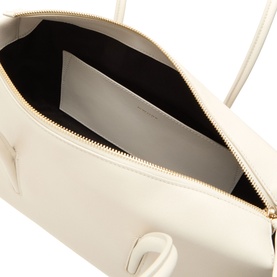 DeMellier Stockholm Shoulder Bag in Chalk, interior view showing zip top opening, internal pocket, and gold-tone hardware detail