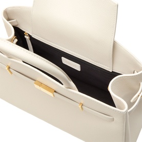 DeMellier The Hudson Midi Top Handle Bag in Chalk, open top view showing black interior, gold-plated hardware and signature belted strap detail