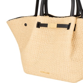 DeMellier The New York Midi Top Handle Bag in warm raffia and black, showing woven raffia body, black leather trims, and tubular top handles with bow
