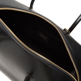 DeMellier The Stockholm Midi Top Handle Bag in black leather, interior view showing gold-tone zip and logo-embossed lining