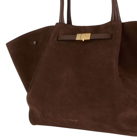 DeMellier The New York Suede Top Handle Bag in mocha, close-up showing gold-plated hardware clasp, tubular handles and triangular side-fold