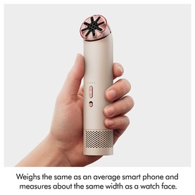 Dyson HushJet&trade; Mini Cool Fan in Stone and Blush, handheld to show compact size, with rose-gold fan head detail