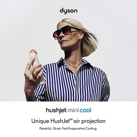 Model with Dyson HushJet Mini Cool Fan in Stone/Blush, held aloft by woman in striped shirt with wind-blown hair