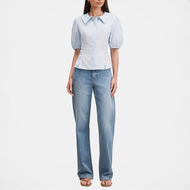 Model wearing Forever New soft blue puff-sleeve collared blouse with light wash straight-leg jeans