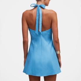 Model wearing Forever New blue halterneck mini dress with tie-back detail, A-line silhouette, back view