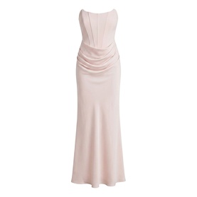Blush pink strapless maxi dress with boned corset bodice, ruched detailing, and flared hem
