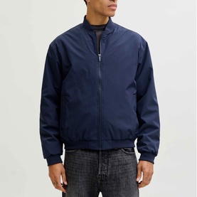 Model wearing Jack & Jones Navy Blazer casual jacket with zip front, ribbed cuffs and collar, styled with dark jeans.