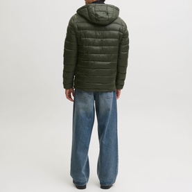 Model wearing Jack & Jones Kingsley Light Hooded Puffer Jacket in Rosin, back view, styled with light blue wide-leg jeans.