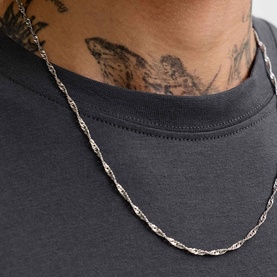 Model with silver twisted rope chain necklace, wearing Jack & Jones Archive Graphic Logo T-Shirt in Asphalt
