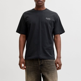 Model wearing Jack & Jones black crew neck T-shirt with small chest script logo, styled with washed khaki jeans.