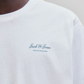 Model wearing white Jack & Jones Archive Selection T-shirt, close-up of chest logo detail in blue script