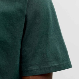Model wearing Jack & Jones Soho Logo T-Shirt in Scarab green, close-up of short sleeve and side seam detail on cotton crew neck tee.