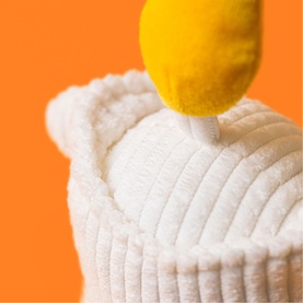 Jellycat Amuseables white plush soft toy with yellow lemon top detail and ribbed corduroy texture, close-up view