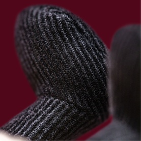 Jellycat Amuseables plush close-up showing black ribbed knit texture detail on soft toy accessory