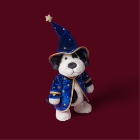 Jellycat white and black plush bear in blue star-print wizard costume with gold trim and pointed hat with star topper