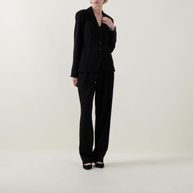Model wearing Joseph Ribkoff black blazer with matching wide-leg trousers and black heels.