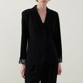 Model wearing Joseph Ribkoff black blazer with satin lapel trim and matching satin cuff detail, three-button front fastening
