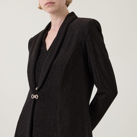 Model wearing Joseph Ribkoff bronze blazer with metallic shimmer, structured shoulders, and embellished gold-tone clasp detail at front