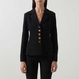 Model wearing Joseph Ribkoff Statement Button Blazer in black with notch lapel, gold statement buttons, and fitted silhouette, styled with black