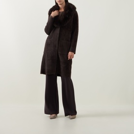Model wearing Joseph Ribkoff Patch Pocket Faux Fur Knitted Coat in Mocha with oversized faux fur collar, longline fit, styled with wide-leg trousers.