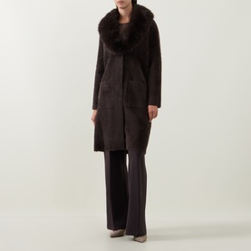 Model wearing Joseph Ribkoff Patch Pocket Faux Fur Knitted Coat in Mocha with oversized faux fur collar, longline fit, styled with wide-leg trousers.