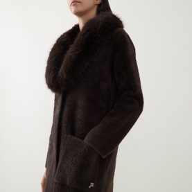 Model wearing Joseph Ribkoff Patch Pocket Faux Fur Knitted Coat in Mocha, showing oversized faux fur collar and cuffs, longline straight hem