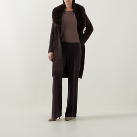 Model wearing Joseph Ribkoff Patch Pocket Faux Fur Knitted Coat in Mocha with oversized faux fur collar, styled with wide-leg trousers and heels.