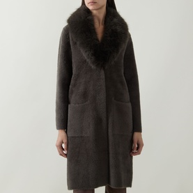 Model wearing Joseph Ribkoff Faux Fur Trim Knitted Cardigan in Avocado, longline with faux fur shawl collar, front pockets, straight hem