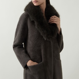 Model wearing Joseph Ribkoff Faux Fur Trim Knitted Cardigan in Avocado, featuring faux fur shawl collar and longline silhouette